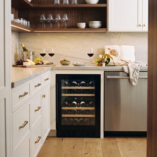 Compact 24 Dual 24-bottle wine cellar installed in a modern fitted kitchen